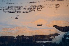 26 First Rays Of Sunrise Light The Glacier Below Mount Victoria Close Up From Lake Louise.jpg